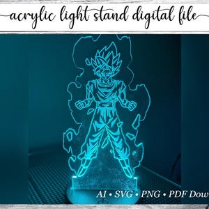 May include: A blue acrylic light stand featuring a glowing outline of a character from Dragon Ball Z. The image includes the text "acrylic light stand digital file" and file type options: AI, SVG, PNG, and PDF.