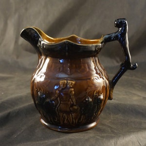 Arthur Wood England Brown Ceramic Glazed Pitcher Jug Lion Handle Gladiator & Lions on Side