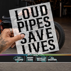 May include: A rectangular decal featuring the black text LOUD PIPES SAVE LIVES in a bold, stylized font. The decal includes a watermark pattern and the brand name Eighty One & Co. at the bottom, with additional text indicating 40+ colors, many sizes, install kit included, and all weather.