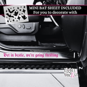 May include: A black and white image of a car interior with a decorative bat sheet and text that reads "Get in bestie, we're going thrifting". The image also includes the text "MINI BAT SHEET INCLUDED For you to decorate with".
