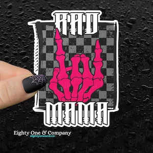 May include: A black and white chequered sticker with a pink skeleton hand making a rock and roll sign. The sticker says "RAD MAMA" in white letters.