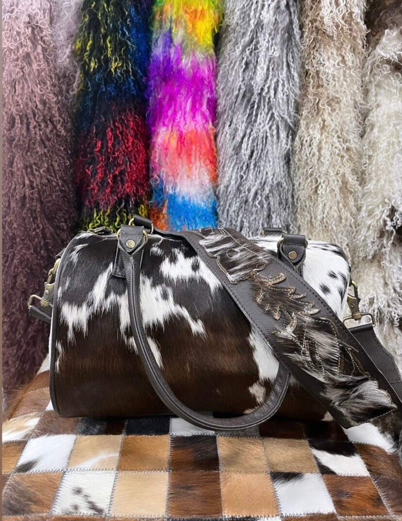 Cowhide duffle shop bag wholesale