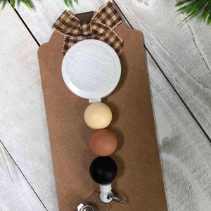 May include: A set of three ceramic mugs with a speckled, matte finish. The mugs are in shades of cream, light gray, and dark gray. Each mug has a simple, minimalist design, perfect for coffee or tea.