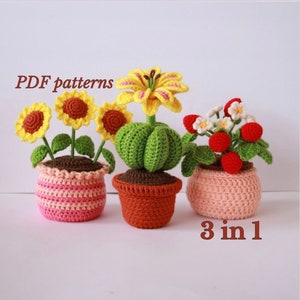 May include: Three crocheted potted plants: a sunflower, a lily, and strawberries. The pots are pink and orange. The text "PDF patterns 3 in 1" is visible.