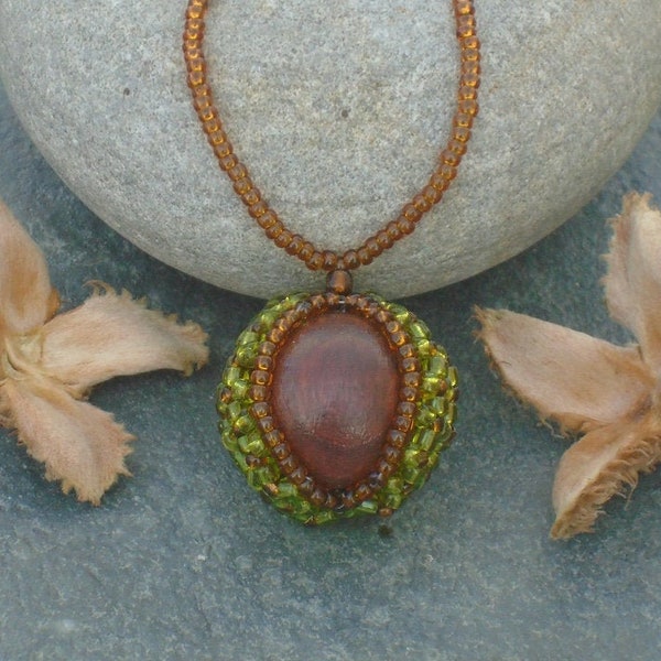 Fallen Conker Necklace, in green and topaz Czech seed beads around a polished wooden ball, UK seller