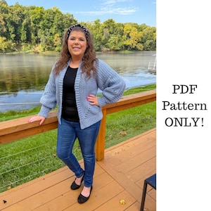 May include: A light blue, long-sleeved, open-front knit cardigan with a textured stitch pattern, worn over a black top and blue jeans. The text 'PDF Pattern ONLY!' is displayed on the right side of the image.