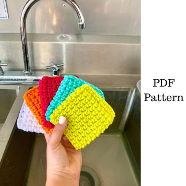 May include: Five crocheted dishcloths in a variety of colors, including white, orange, red, turquoise, and yellow. The dishcloths are stacked on top of each other and being held by a hand. PDF Pattern.