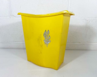 Vintage gele plastic prullenbak met bladzilver