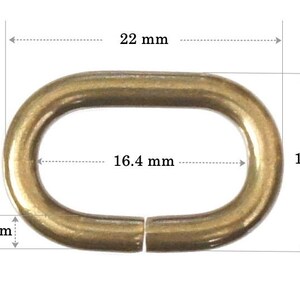 May include: Gold-toned metal oval ring with a 22 mm outer diameter, 16.4 mm inner diameter, and 14 mm height. The ring is 2.8 mm thick.