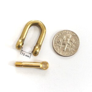 May include: A brass swivel snap hook with a threaded eyelet. The hook is 7.5 mm wide and is shown next to a US dime for scale.