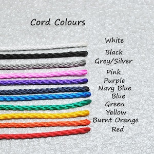 May include: A selection of cord colours, including white, black, grey/silver, pink, purple, navy blue, blue, green, yellow, burnt orange, and red.