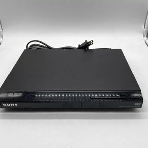 Pre-Owned Sony DVP-SR210P Ultra Slim DVD/CD Player w/ Pre-Programed Universal Remote & A/V Cables