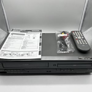 Pre-Owned Magnavox MWD2205 DVD/VCR Combo Player - w/ Original Remote, Manual, A/V Cords, & HDMI converter