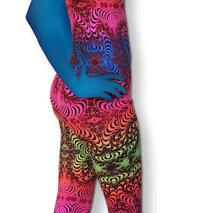 May include: A pair of leggings with a colorful psychedelic pattern. The leggings are made of a stretchy fabric and have a high waist.