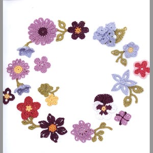 May include: A collection of crocheted flowers in various colors, including purple, pink, red, yellow, and white. The flowers are arranged in a circle on a white background.