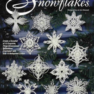May include: A crochet pattern booklet featuring 12 different snowflake designs. The cover features a large white snowflake with the title "Crochet Dimensional Snowflakes" and the text "Designed by Jo Ann Maxwell".