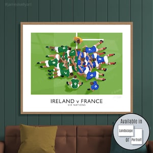 May include: A framed print depicting a rugby match between Ireland and France. The artwork shows players in green and blue uniforms on a green field. The text "IRELAND v FRANCE SIX NATIONS" is displayed below the image.