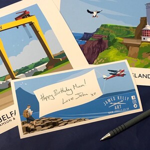 A birthday card with a handwritten message and an illustration of a person standing on a rocky cliff overlooking a body of water, with a bird flying overhead.