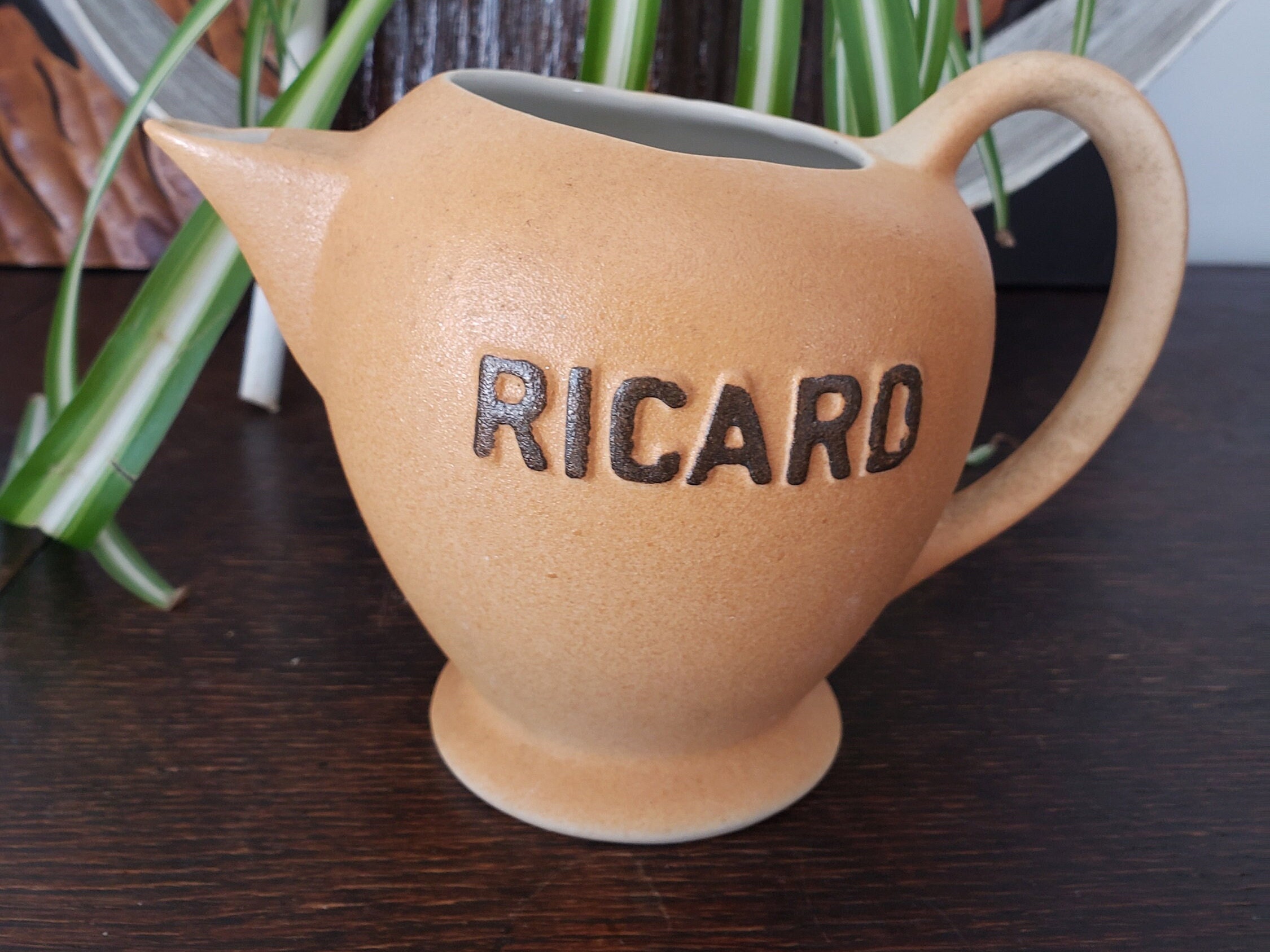 Enamelled earthenware pitcher Ricard and glass carafe …
