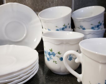Arcopal, 4 vintage French coffee cups and saucers. White milk glass with a blue Veronica pattern. Forget-me-nots