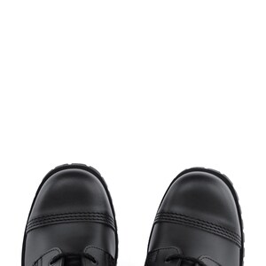 May include: A pair of black leather boots with a cap toe design. The boots have black laces and a sturdy sole. The image is a top-down view of the boots against a white background.