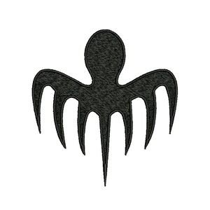May include: A black embroidered octopus-like emblem with a stylized design. The emblem features a central rounded body with six elongated, curved tentacles extending outwards. The design is set against a plain white background.