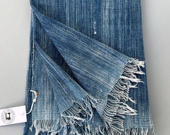 Blue mud cloth throw for a wabi sabi home decor vibe. Boho farmhouse textile with hand embroidered patch.