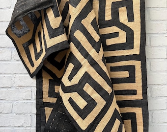 Hand made tapestry kuba cloth with hand stitched geometric designs of black and natural raffia. Abstract art piece for wall decor.