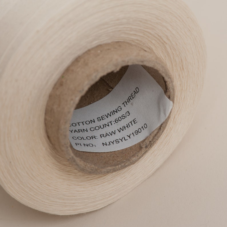 Raw unbleached cotton overlocker spool on cardboard cone with paper wrap. 100% Plastic free and biodegradable image 3