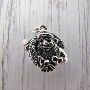 The Joy of Eternity -The Joy of Santa Collection Charm is Santa with a Wreath sterling silver charm alone or on a bracelet