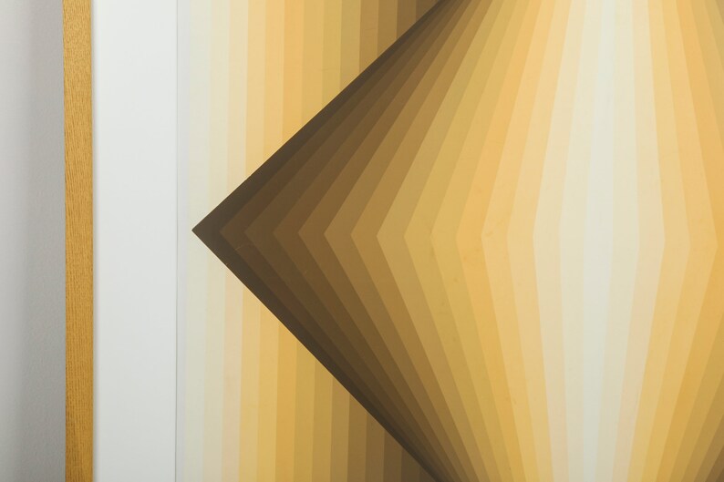 May include: Abstract geometric art print with a brown and beige color scheme. The print features a series of overlapping, angled lines that create a sense of depth and movement.