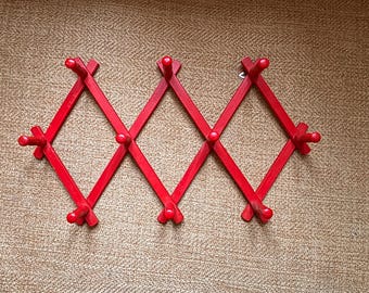 Red wood wall scissor rack Danish