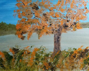 May include: A painting of a tree with orange leaves against a blue sky. The tree is in the center of the painting and is surrounded by a field of green and orange brushstrokes.
