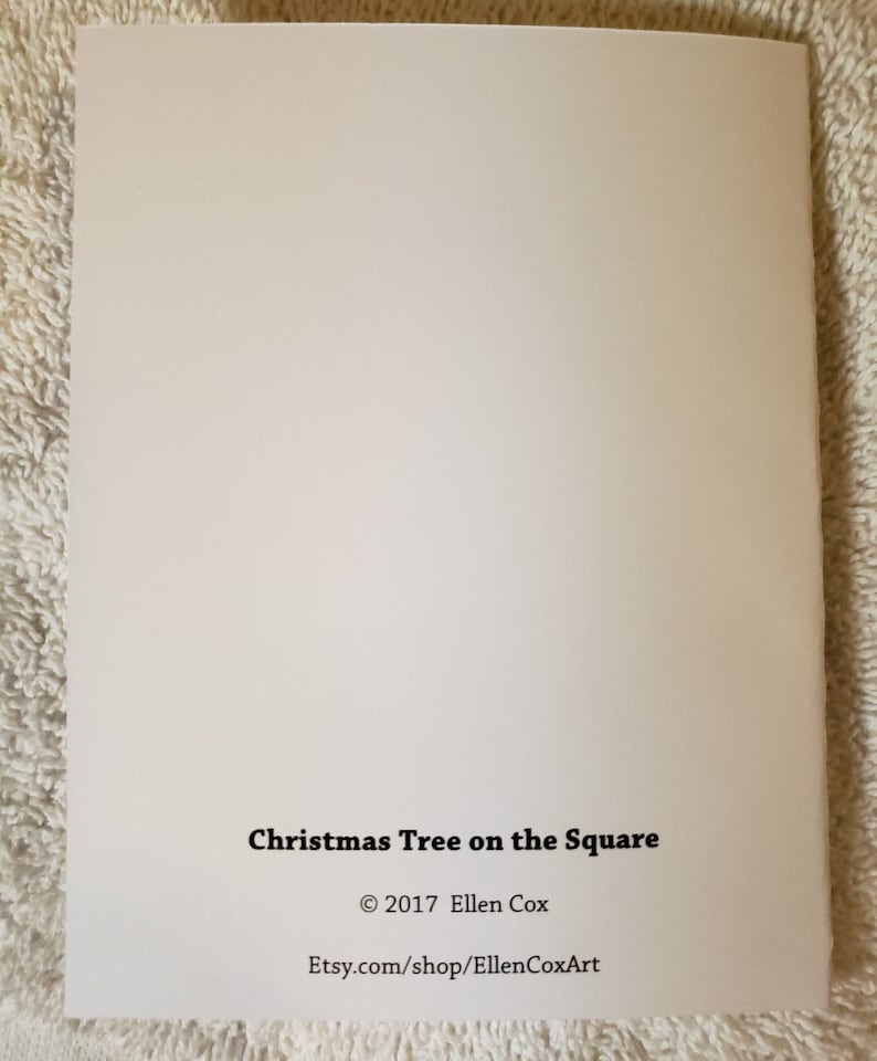 May include: A cream-coloured greeting card featuring the text "Christmas Tree on the Square" in black. The card also includes the copyright information: &copy; 2017 Ellen Cox and the Etsy shop URL.
