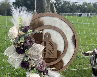 Authentic cowhide door hanger. wood flowers
