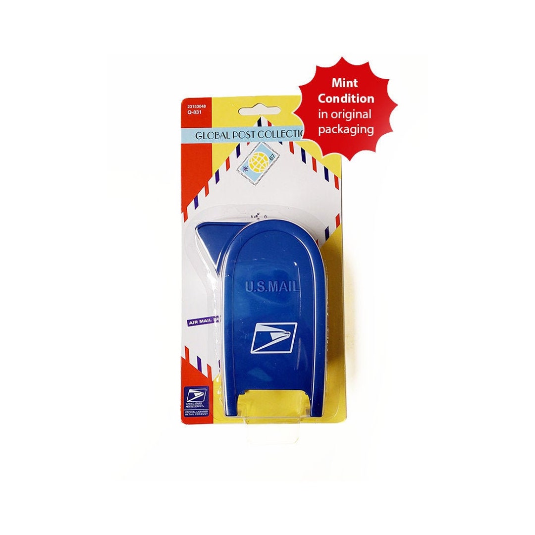 A cute little USPS Mailbox postage stamp dispenser.