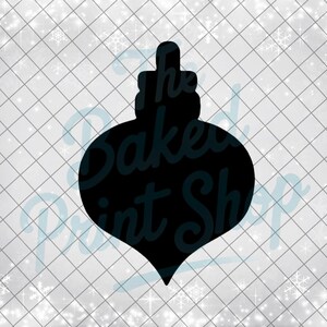 May include: Black silhouette of a Christmas ornament with a decorative top. The text "The Baked Print Shop" is visible on the ornament. The background is a white grid pattern with snowflakes.