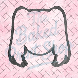 May include: A black cookie cutter in the shape of a tooth, set against a pink background with a grid pattern. The text "The Baked Print Shop" is visible in the background. This cutter is likely for baking themed treats.