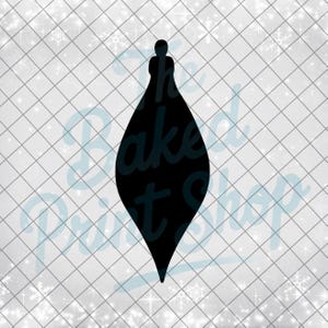 May include: A black teardrop-shaped Christmas ornament silhouette. The ornament has a small, rounded top and a pointed bottom. The background is a light gray grid pattern with scattered white snowflake and sparkle accents.