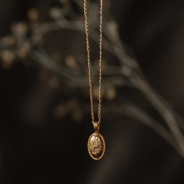 Collar con urna ovalada para cenizas con diseño de nomeolvides