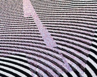 May include: Abstract geometric pattern with black and white stripes and a pink and purple gradient. The pattern is made up of curved lines that create a sense of movement.