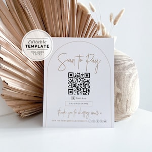 Puede incluir: Un cartel blanco con un arco dorado y el texto "Scan to Pay" en letra manuscrita. Un código QR se muestra en el centro del arco. Debajo del código QR está el texto "$ Cash App" y "SBUSINESSNAME". El texto "Thank you for shopping small x" se muestra debajo del nombre del negocio. El texto "JOIN THE TRIBE @SMALLBUSINESSCO" se muestra debajo del mensaje de agradecimiento, junto con los iconos de redes sociales para Facebook, Instagram y Twitter.
