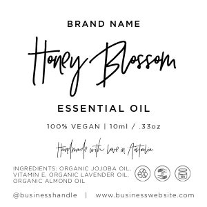 May include: A product label for Honey Blossom Essential Oil, a 100% vegan product made with love in Australia. The label features a handwritten logo, ingredients list, and contact information. The product is packaged in a 10 ml / 0.33 oz bottle.