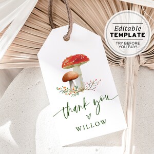 May include: A white thank you tag with a green handwritten "thank you" and the name "Willow" in green text. The tag features a watercolor illustration of two mushrooms with red and white caps and brown stems. The mushrooms are surrounded by green leaves and red berries.