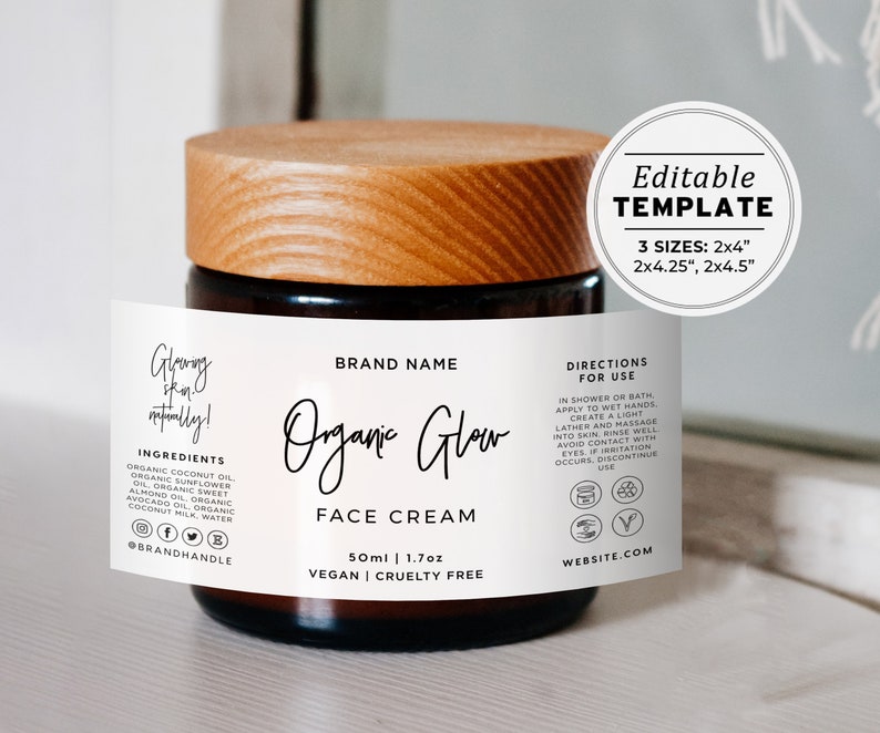 May include: A white label with black text on a glass jar with a wooden lid. The label reads "Organic Glow Face Cream" with the brand name, ingredients, directions for use, and website information. The jar is 50 ml or 1.7 oz and is vegan and cruelty-free.