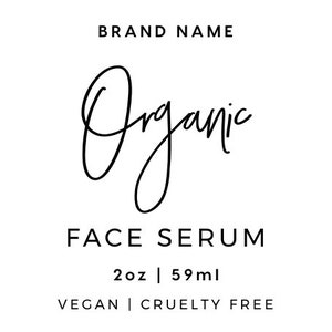 May include: A product label for an organic face serum. The label is white with black text. The brand name is "Organic" and the product name is "Face Serum". The ingredients are listed as: Organic Coconut Oil, Organic Sunflower Oil, Organic Sweet Almond Oil, Organic Avocado Oil, Organic Coconut Milk, Water. The product is 2 oz or 59 ml. The label also states that the product is vegan and cruelty free. The directions for use are listed below the product information. The website address is www.website.com and the social media handle is @brandnamehandle.