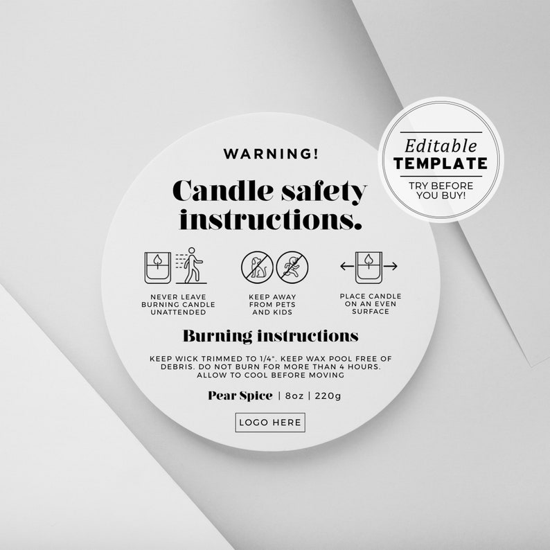 May include: A white circular label with black text and icons detailing candle safety instructions. The label includes warnings about unattended burning, pets, and surface placement. It also lists burning instructions and the scent "Pear Spice" at 8oz (220g).