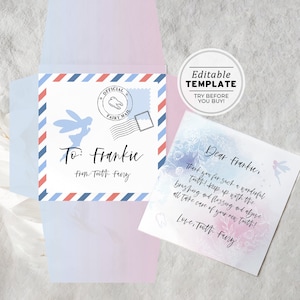 May include: A blue and white card with a tooth fairy design. The card says "To: Frankie From Tooth Fairy" and "Official Fairy Mail". The card is folded in half and has a pink envelope.