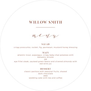 May include: A round, white menu with the text "WILLOW SMITH" in brown at the top. The menu lists the following items: Salad, Main, and Dessert. The menu items are written in brown text.