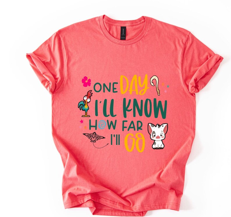 May include: A coral pink t-shirt with a green, yellow, and blue graphic print featuring a rooster, a butterfly, and a pig. The text on the shirt reads "One Day I'll Know How Far I'll Go."